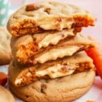 A stack of soft and chewy carrot cake cookies filled with a rich, creamy cheese filling. These delicious cookies are packed with warm spices, shredded carrots, and nuts, making them the perfect twist on a classic Carrot Cake Cookies Recipe for a sweet and indulgent treat.