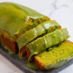 Vegan Matcha Cake Recipe – A beautifully moist and fluffy green tea loaf cake with a rich, vibrant green color. Topped with a smooth and glossy matcha glaze, this plant-based dessert is both visually stunning and deliciously flavorful. Perfect for tea lovers and those craving a naturally sweet, earthy treat.