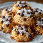 No Bake Moose Farts piled on a plate, golden on the edges with shredded coconut and mini chocolate chips sprinkled on top.