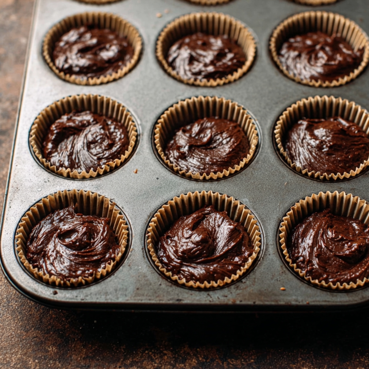 Easy Smores Brownie Cupcakes 10 Slide the pans into the oven and bake for 25 to 28 minutes. Start checking at 22 minutes by inserting a toothpick into the center. It should come out with a few moist crumbs but no wet batter. Let the cupcakes cool completely in the pans before frosting.