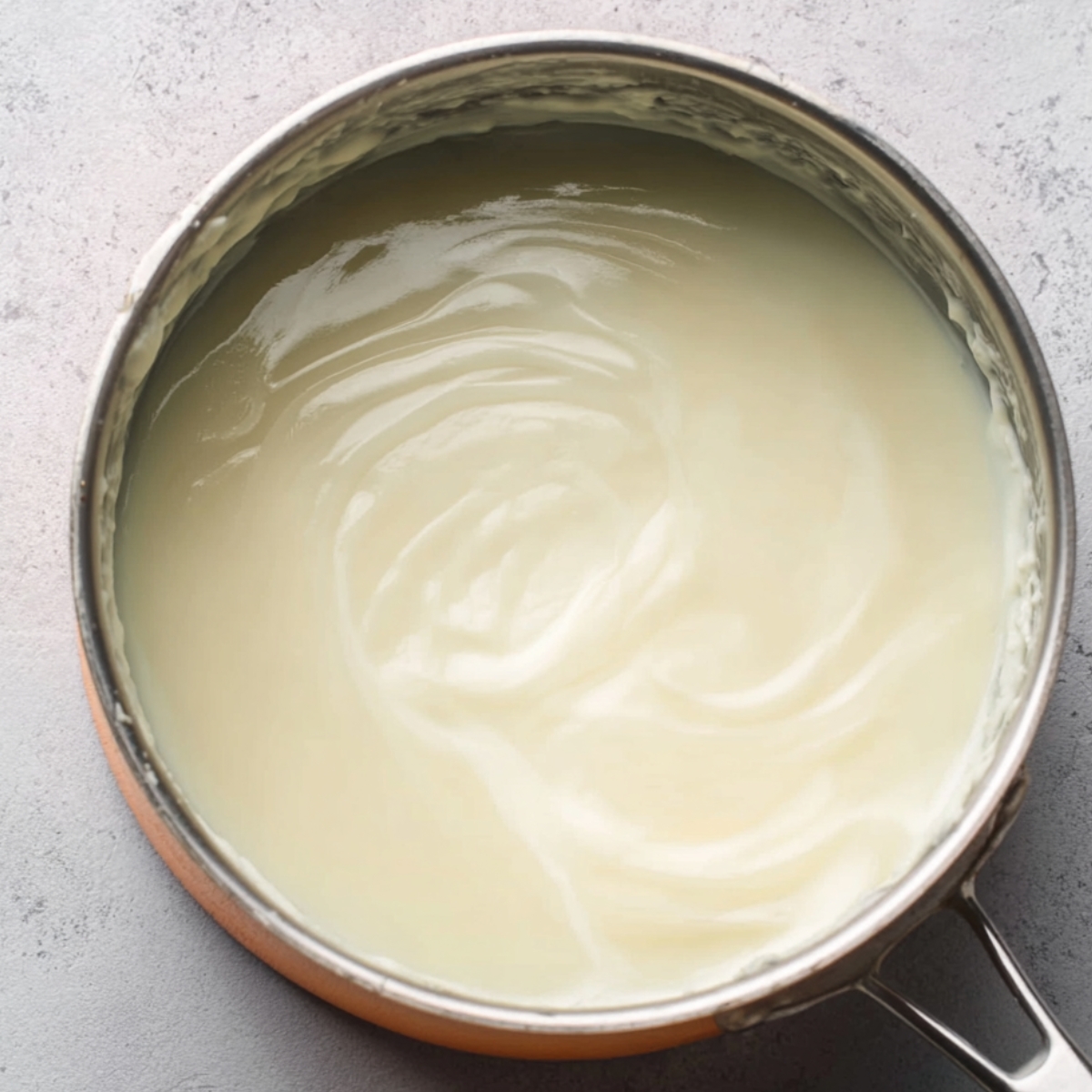 Place the saucepan over medium heat and stir constantly with a whisk or wooden spoon. The mixture will start to thicken after about 5 to 7 minutes and should bubble gently. Keep stirring so nothing sticks to the bottom.