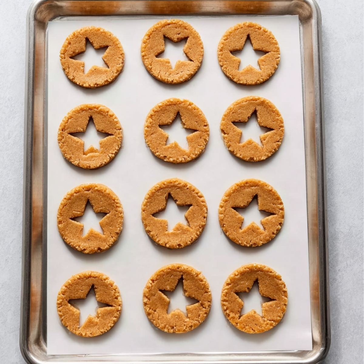 Easy Linzer Cookies Recipe | Nutty Jam-Filled Cookies 12 Take a 1-inch round or fluted cutter and cut a hole in the center of 32 of the cookies. These will be your top cookies with the jam peeking through.
