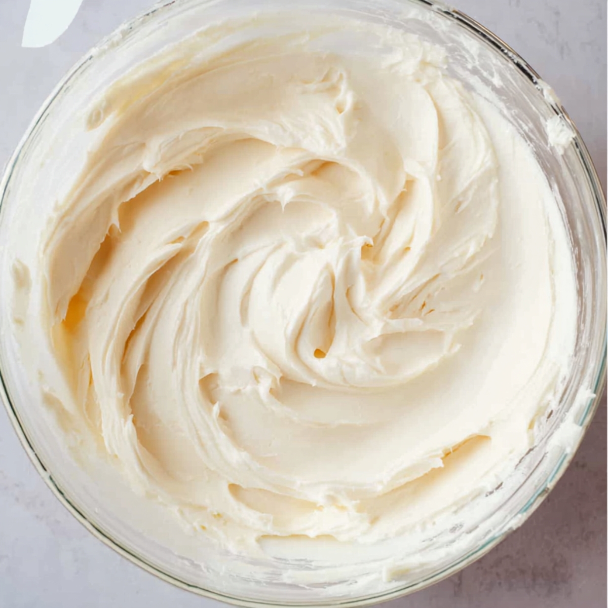 In another bowl, beat the softened cream cheese until smooth and creamy. Add the powdered sugar and vanilla extract, then mix until fully combined. Taste it—it should be lightly sweet and tangy.