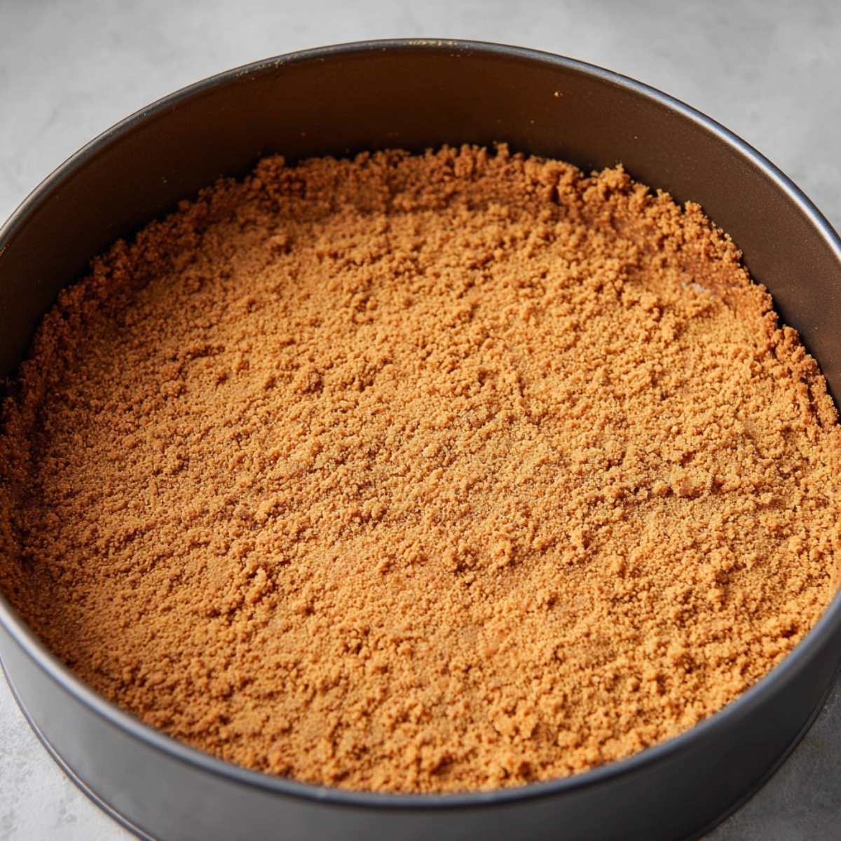 Easy Lotus Biscoff Cheesecake 10 In a medium bowl, mix together the digestive crumbs, Biscoff crumbs, melted butter, and cinnamon with a fork until everything looks like wet sand. Press the mixture firmly into the bottom and up the sides of a greased 9-inch springform pan, using the bottom of a measuring cup to pack it down tight. Pop the pan in the fridge while you make the filling.