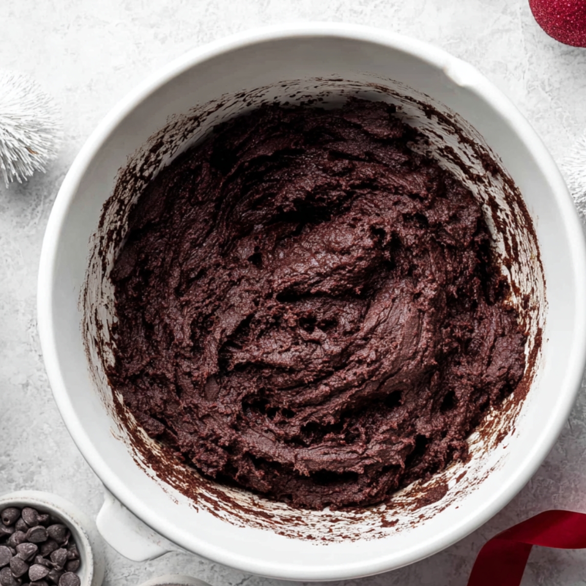 Add your flour, cocoa powder, baking powder, baking soda, and salt all at once. Mix just until you can't see any dry streaks anymore. Don't overmix, or your cookies might turn out tough. The dough will be thick and chocolatey.