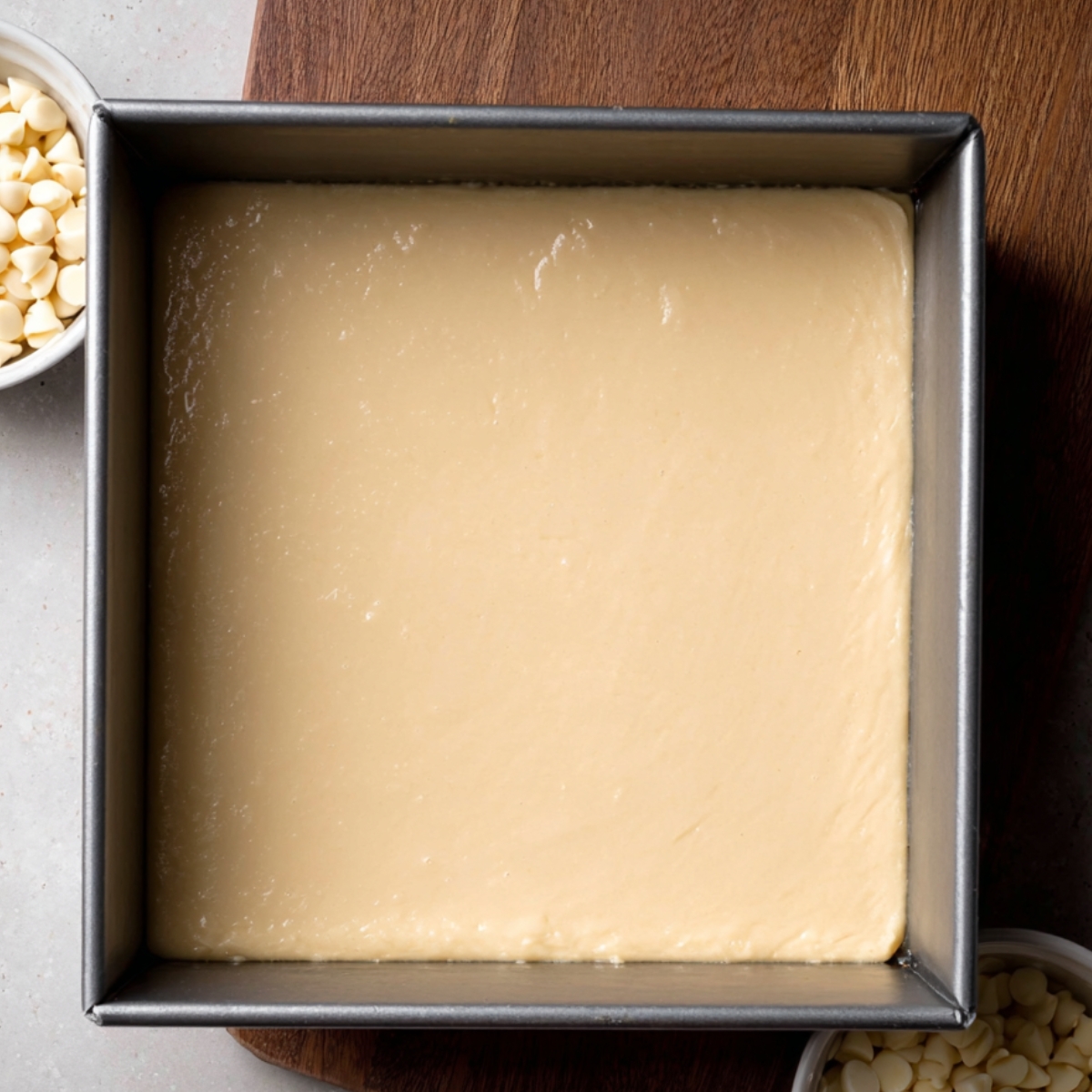 White Chocolate Brownies Recipe | Fudgy & Easy 13 Transfer the brownie batter into your prepared 9x9-inch pan. Use a mini offset spatula to spread it evenly across the pan, smoothing the top.