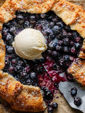 Blueberry Galette Recipe | Better Than Pie in 2 Hours 15 Baked Blueberry Galette with golden flaky crust topped with a scoop of vanilla ice cream.