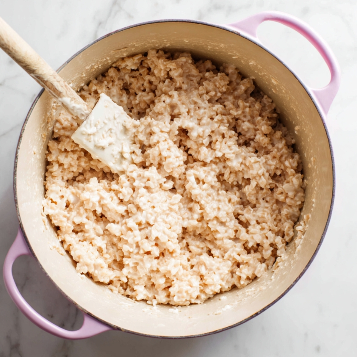 Soft Rice Krispie Treats Recipe 10 Mixing crispy rice cereal into melted marshmallow mixture in a large pot