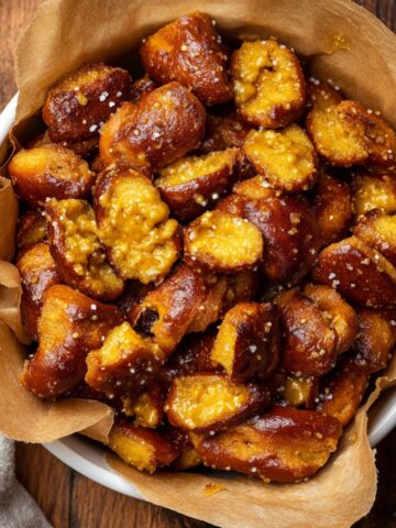 Honey Mustard Pretzel Pieces 16 Bowl of Honey Mustard Pretzel Pieces sprinkled with coarse salt and lined with parchment paper