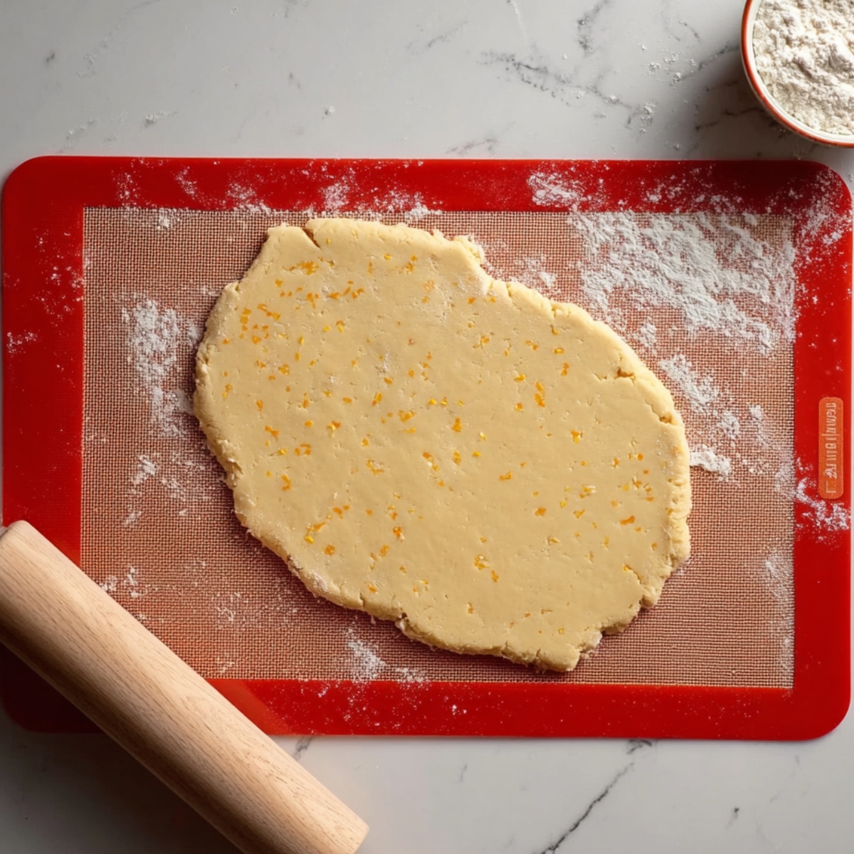 Chocolate Orange Sandwich Cookies 11 Rolled orange cookie dough on baking mat
