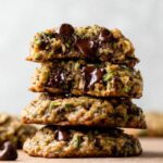 Stacked Zucchini Chocolate Chip Cookies with gooey melted chocolate.
