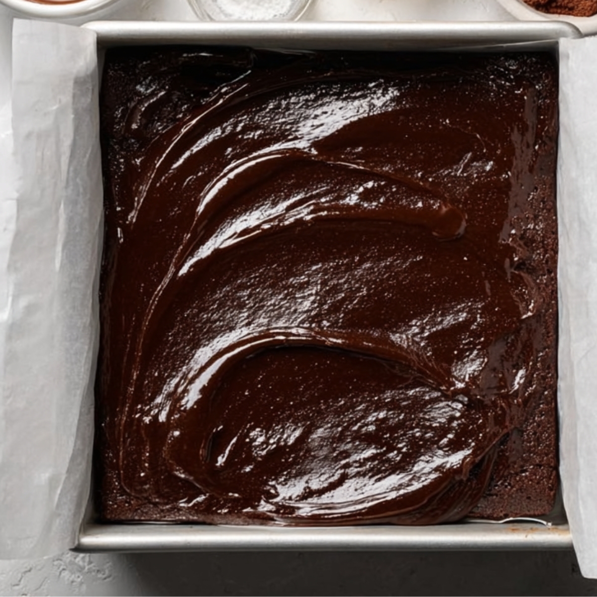 Easy Marshmallow Swirl Brownies Recipe 10 A pan of smooth, glossy brownie batter ready to be baked, showing the rich chocolatey texture.
