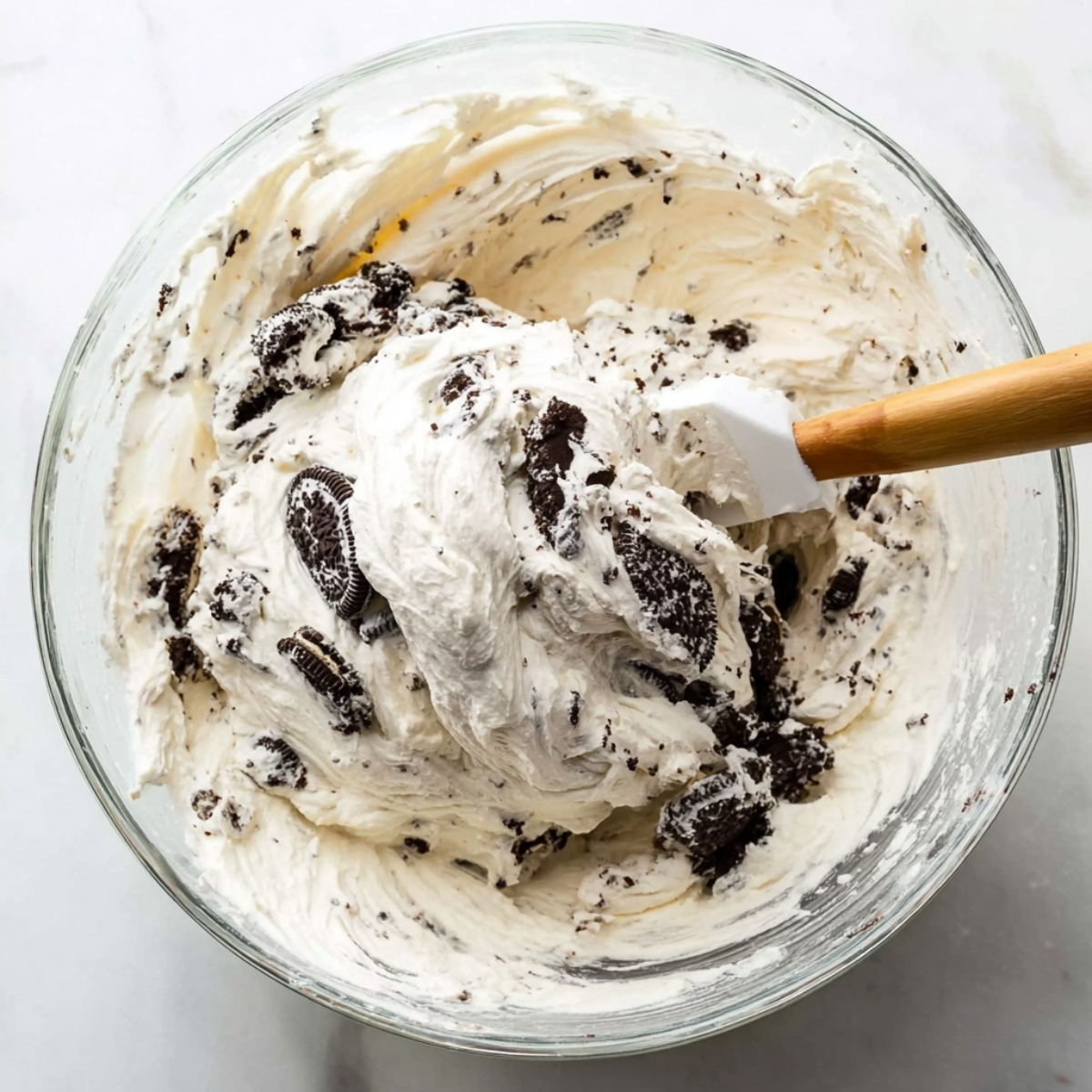 No-Bake Cookies and Cream Pie 11 Mixing cookies and cream filling for the pie