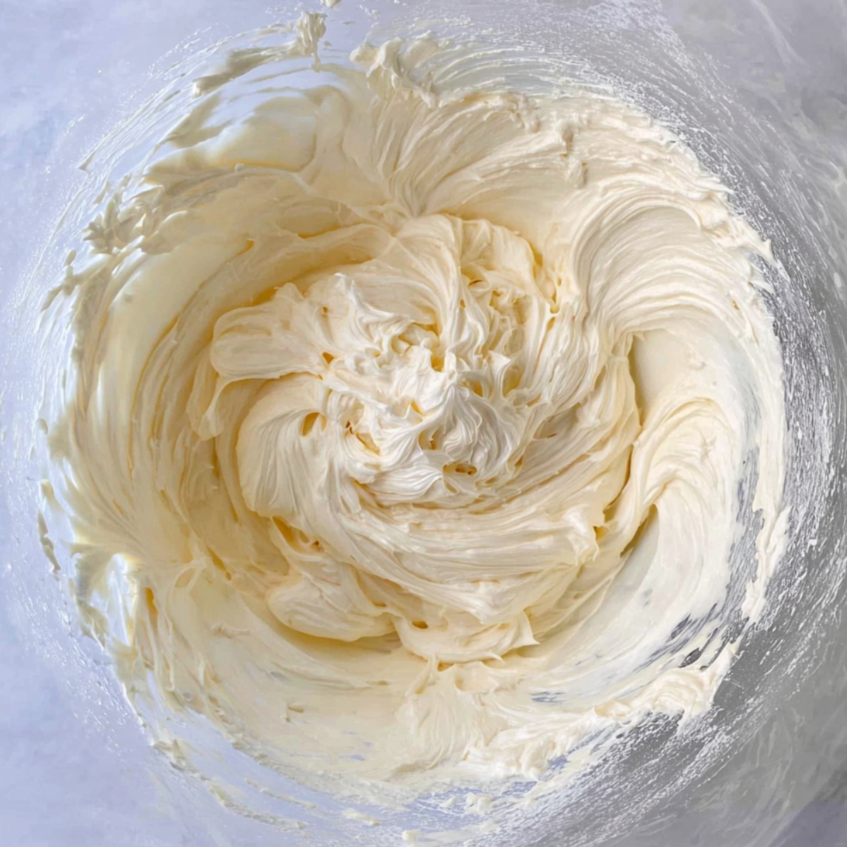 Easy Cheese Heart Danishes Recipe 10 A smooth, creamy filling being mixed in a bowl, ideal for filling heart-shaped pastries or other desserts.