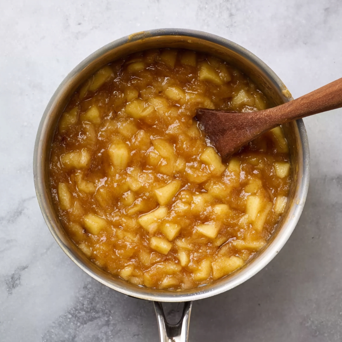 Easy Homemade Fried Apple Pies 10 Simmering apple filling in a pan.