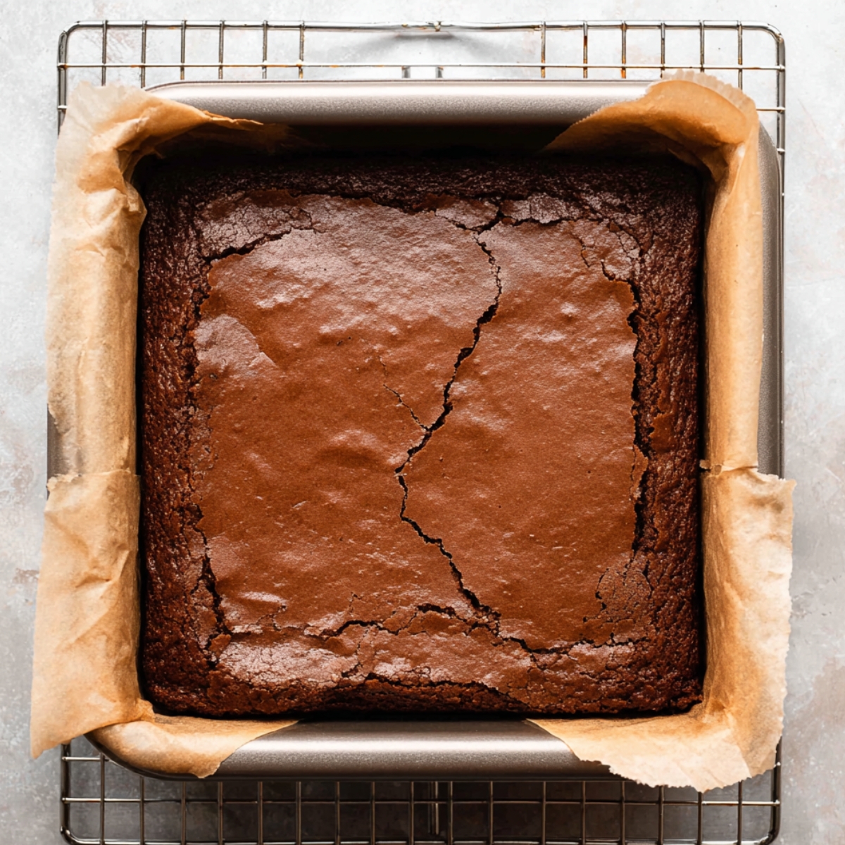 The Best Cookie Dough Brownies Recipe 10 A brownie freshly baked in a pan and placed on a cooling rack.
