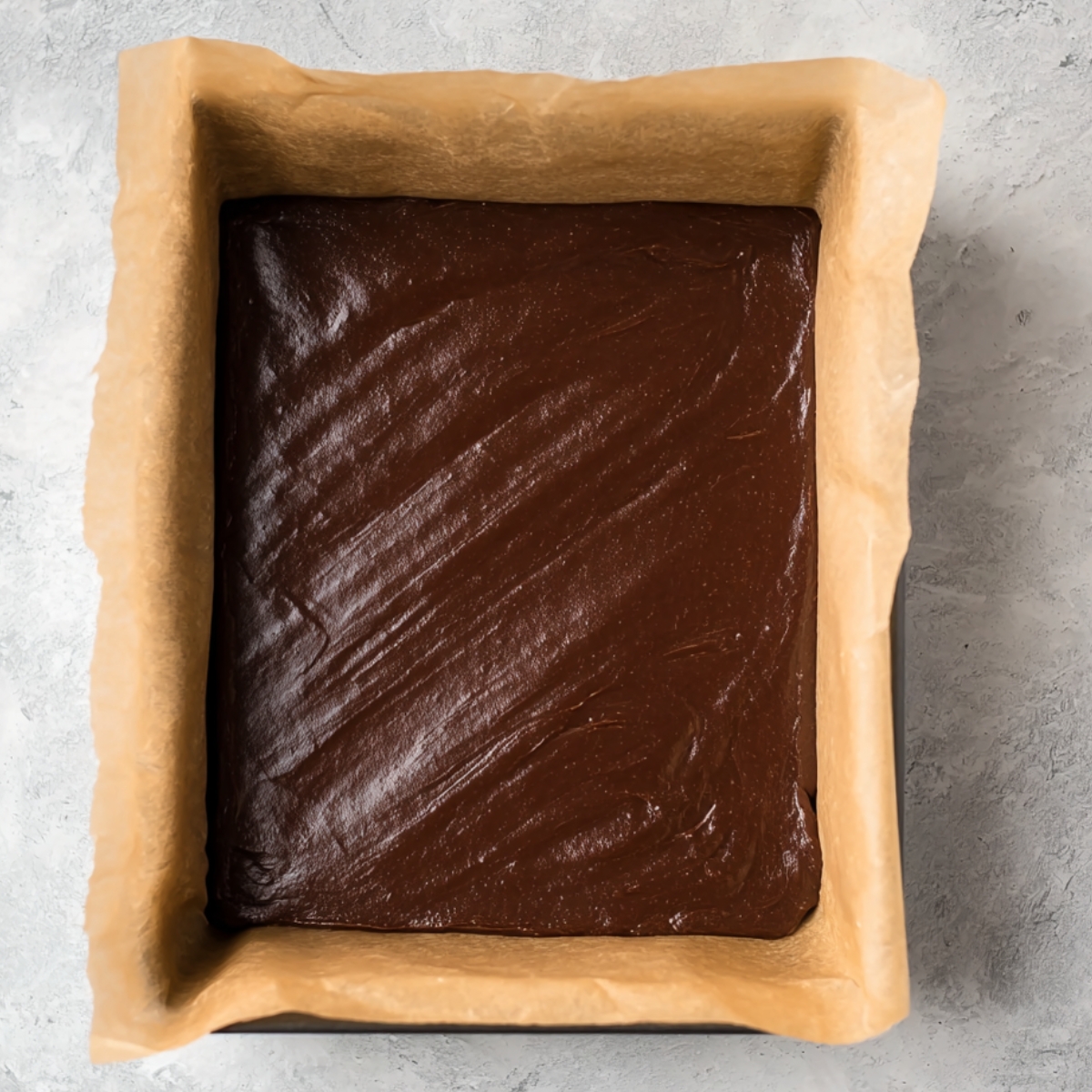 Best Knock You Naked Bars Recipe 10 Baked German chocolate cake mix dough spread evenly in a parchment-lined 9x13-inch pan.