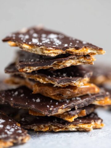 Easy Chocolate Matzo Crack Recipe 3 A stack of Chocolate Matzo Crack pieces with a crispy texture, sprinkled with sea salt.