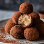 Neatly shaped Tiramisu Balls arranged on a plate, ready to be coated or served.