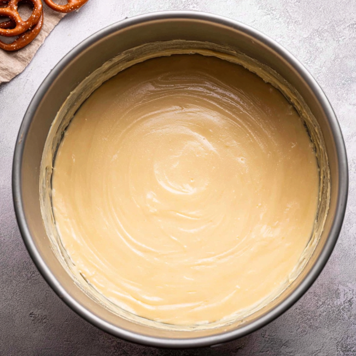 Best Salted Caramel Cheesecake 11 Smooth and creamy cheesecake batter in a springform pan, ready to be baked to perfection.