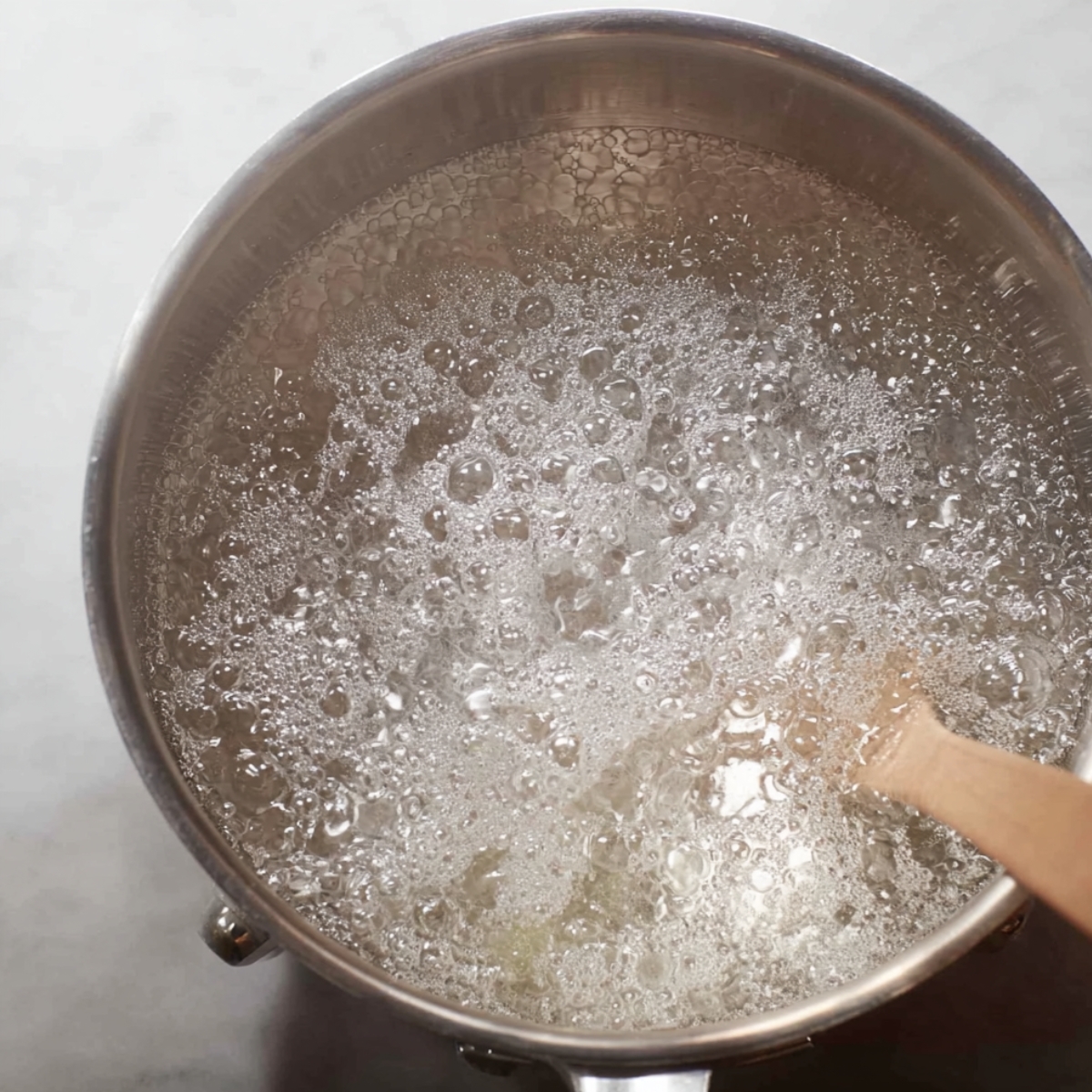 Best Candied Walnuts Recipe 10 Bubbling syrup mixture, indicating the early stages of caramelization.