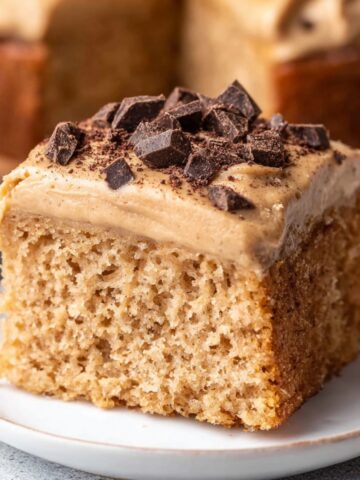 Easy Brown Sugar Latte Cake Recipe 2 Slice of Brown Sugar Latte Cake topped with coffee frosting and chocolate chunks.
