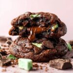 Gooey Chocolate Mint Cookies with melted chocolate spilling from the center.