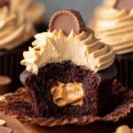 Peanut Butter Cup Cupcakes with frosting and a peanut butter center.