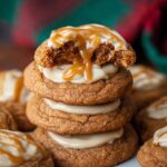 A stack of gooey Sticky Toffee Pudding Cookies filled with toffee and drizzled with caramel sauce.