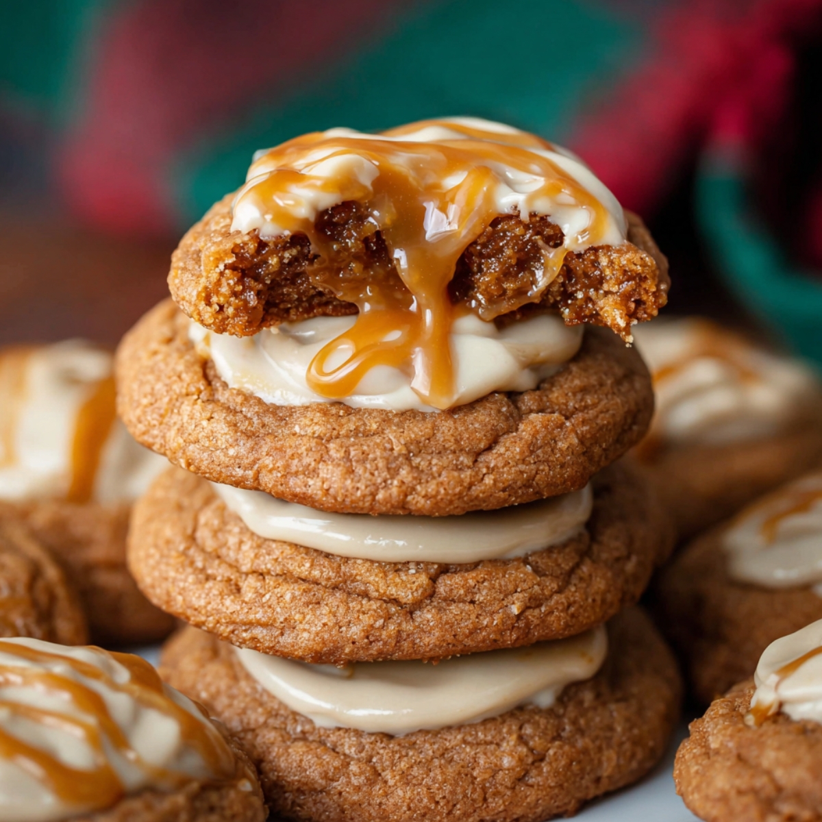 Easy Sticky Toffee Pudding Cookies 9 A stack of gooey Sticky Toffee Pudding Cookies filled with toffee and drizzled with caramel sauce.