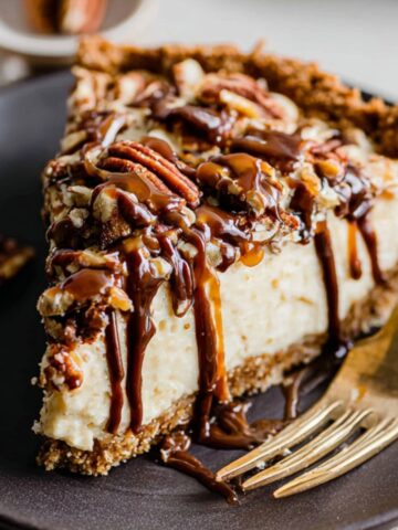 Easy Turtle Pie Recipe 1 Slice of Turtle Pie topped with caramel, chocolate drizzle, and pecans.