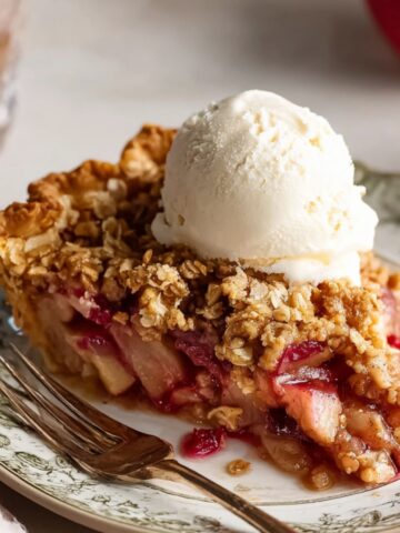 Easy Apple Cranberry Crumble Pie 2 Apple Cranberry Crumble Pie slice with vanilla ice cream on top.