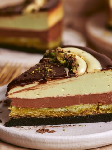 No Bake Dubai Chocolate Cheesecake 1 Slice of No Bake Dubai Chocolate Cheesecake with chocolate cookie crust, crispy pistachio knafeh, chocolate ganache, and creamy pistachio cheesecake filling.