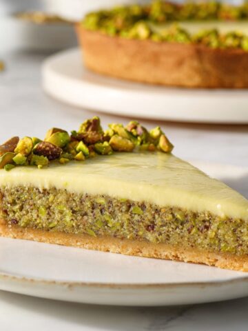 Easy Pistachio Tart Recipe 1 Slice of triple Pistachio Tart with buttery crust, moist pistachio sponge, silky pistachio cream, and chopped pistachio topping.