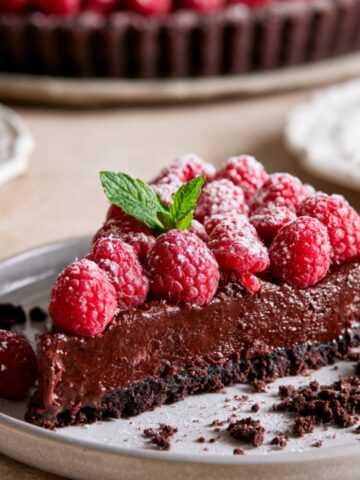 Easy Chocolate Raspberry Tart Recipe 1 Chocolate raspberry tart slice topped with fresh raspberries and mint