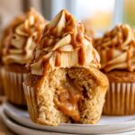 Moist dulce de leche cupcakes filled with gooey caramel, topped with caramel buttercream and dulce de leche drizzle